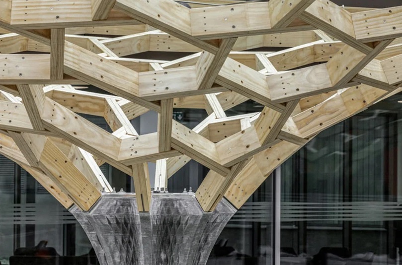 Close-up of the top of the column at the interface of the wooden structure Close-up of the top of the column at the interface of the wooden structure